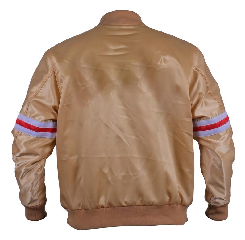 Back view of gold satin bomber jacket – classic varsity style with striped sleeves and ribbed hem