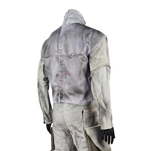 May include: A light gray jacket and pants set. The jacket has a high collar and a padded back. The pants have pockets on the sides. The outfit is made of a durable material and is suitable for costume or cosplay.