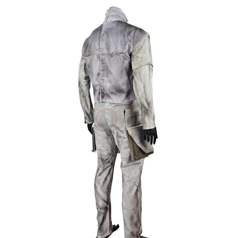 May include: A light grey costume with a jacket, pants, and gloves. The jacket has a high collar and a textured appearance. The pants have pockets and a worn look. The costume is designed for cosplay or themed events.