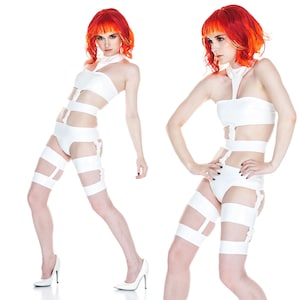 May include: Two images of a person wearing a white, futuristic-style outfit. The outfit includes a halter top, high-waisted bottoms, and thigh-high straps. The person is also wearing white high heels. The person has bright red and orange hair.