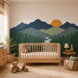 May include: A wall mural featuring a landscape of dark blue mountains, a large orange sun, green pine forests, and a winding river. The mural is displayed behind a light-coloured wooden crib with a white mattress, placed on a textured rug.