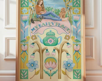 May include: A framed watercolor print featuring a woman reading with a dog and cat in a field, above a teapot and floral design. The words "MY HAPPY PLACE" are arched across the top of the teapot. The artwork is in a wooden frame.
