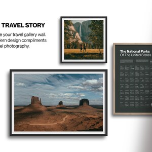 May include: A framed print of a landscape photograph featuring a desert scene with three rock formations in the distance. The sky is blue with white clouds. The print is in a black frame.