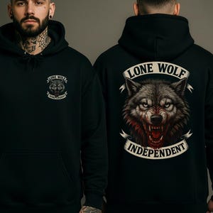 May include: Black hoodie with a front pocket and a hood. The front features a small wolf graphic with the text "LONE WOLF INDEPENDENT". The back displays a larger wolf graphic with the same text on a banner. The wolf is depicted with red accents.