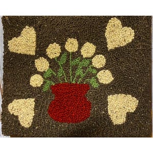 Large primitive flower rug. Done with wool yarn.