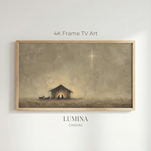 Puede incluir: Una impresión en lienzo enmarcada que representa una escena de la natividad en tonos sepia. La obra de arte muestra un establo humilde iluminado desde adentro, con figuras silueteadas en su interior. El texto "4K Frame TV Art" y "LUMINA CANVAS" son visibles.