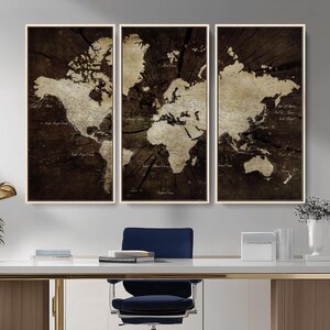 May include: A triptych of framed world maps. Each panel features a sepia-toned world map design set against a dark brown, wood-grain background. The maps are detailed with continents and country names.