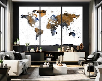May include: A triptych world map print with a white backdrop and a distressed, textured look. Continents are rendered in brown, blue, and gold. The artwork is displayed in a modern living room setting, above a black and white cabinet.