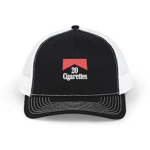 May include: Black and white trucker hat with a curved brim. The front panel is black with a red and white logo that reads "20 Cigarettes". The hat has a white mesh back and a snap closure.
