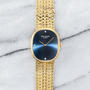 Vintage Patek Philippe Ellipse 18K Yellow Gold Blue Dial Manual Wind 28mm Case