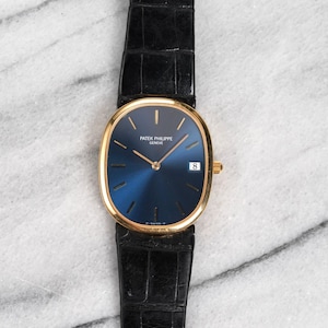 Vintage Patek Philippe Ellipse 18K Yellow Gold Blue Dial 1970s Quartz 28mm Case