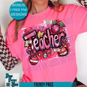 May include: A bright pink t-shirt with a graphic that says "Teacher" in a graffiti style, decorated with stars and Christmas ornaments. The shirt has long sleeves with a checkered pattern on the cuffs. The words "Bonus 2 Free PNG Designs" are in a circle on the top left.