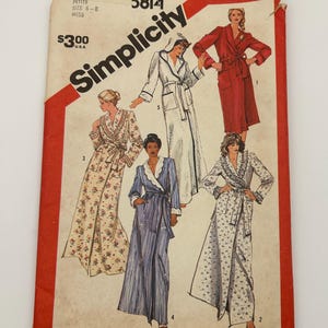 May include: Vintage Simplicity sewing pattern envelope featuring illustrations of five different robes. The envelope is red and white with the Simplicity logo and the number 5814. The robes are in various colors and patterns.