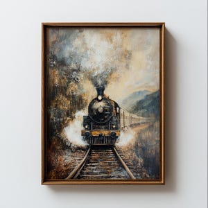 May include: A framed painting of a vintage steam train traveling on tracks through a landscape. The train is black and gold, with smoke billowing from its smokestack. The artwork has a muted color palette with brown, gray, and beige tones.