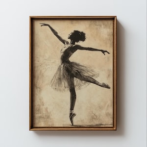 May include: A framed print featuring a ballerina in a ballet pose. The artwork is a sepia-toned sketch, showing the dancer in a tutu and pointe shoes. The frame is a warm brown, enhancing the vintage feel. The ballerina's arms are outstretched, and her body is in motion.