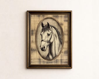 May include: A framed wall art piece featuring a black and white charcoal-style drawing of a horse head wearing a bridle. The portrait is enclosed in an oval border set against a textured, tan-colored background with a subtle plaid pattern.