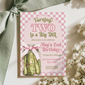May include: A pink and white gingham birthday invitation with the text "Turning TWO is a Big Dill." The invitation features a watercolor illustration of pickles in a jar and a pink bow. White flowers and a green ribbon are in the background.