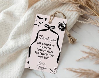May include: A light pink party favor tag with black graphics of bats, stars, a disco ball, and a spiderweb. The tag has a black ribbon design and reads "Thank you for coming to my party! I had so much fun celebrating with you! Love, Maggie."