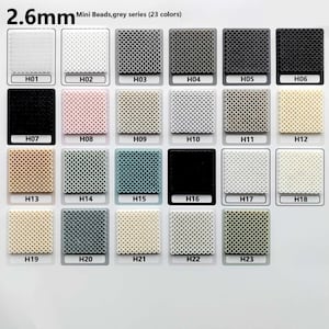 May include: A color chart of 23 shades of 2.6mm mini beads in the grey series. The colors range from white to black, with various shades of grey, beige, and pastel colors. Each color is labeled with a code, such as H01, H02, etc.