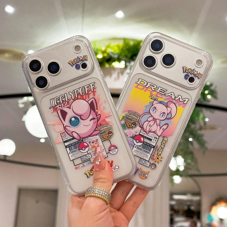 May include: Two clear phone cases featuring Pokemon characters. One case displays Jigglypuff with the text "Jigglypuff" and the other case shows Mew with the text "Dream". Both cases have the Pokemon Go logo and colorful graphics.