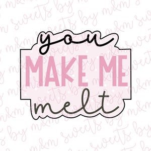 May include: A cookie cutter with the words "you make me melt" in black and pink. The text is inside a pink rectangle with a scalloped top and bottom edge. The background is white with a repeating pattern.