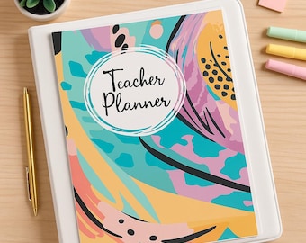 Könnte beinhalten: Ein weißer Ordner mit einem farbenfrohen Einband mit dem Text "Teacher Planner" in einem kreisförmigen Design. Der Einband hat ein abstraktes Design mit türkisen, rosa, gelben und schwarzen Formen. Ein goldener Stift und eine kleine Topfpflanze sind sichtbar.