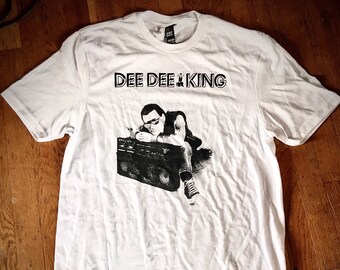 Dee Dee King T-Shirt. From the sleeve of Dee Dee Ramones 1980's rap record "Standing in the Spotlight"