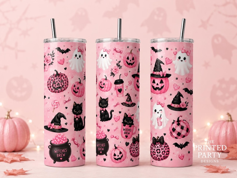 May include: Three tall cylindrical tumblers with silver straws, featuring a light pink background covered in a repeating pattern of black cats, white ghosts, pink pumpkins, witch hats, and cauldrons labeled Witches Brew in black text.