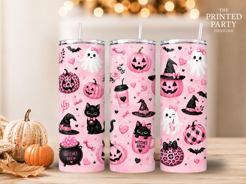 May include: Three cylindrical tumblers with lids and straws featuring a pink background with Halloween-themed illustrations including black cats, ghosts with pink bows, pink pumpkins, witch hats, and cauldrons labeled Witches Brew.