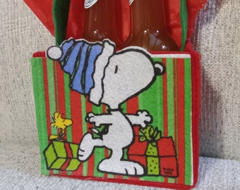 Snoopy bag with 2 5oz bottles of Sadistic Mistress Sauces hot sauce