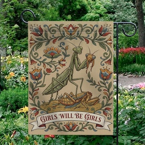 May include: A beige garden flag featuring a detailed illustration of a praying mantis holding a smaller insect. The design includes floral elements in red, blue, and orange, with the text "GIRLS WILL BE GIRLS" on a banner.