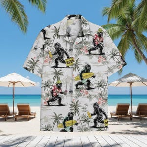 May include: White button-up shirt with a repeating pattern of a Bigfoot-like creature holding beer, a surfboard, and a beer sign. The shirt has a tropical floral and palm tree design. The background shows a beach scene with palm trees, umbrellas, and lounge chairs.