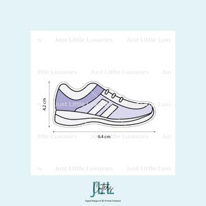 May include: A shoe-shaped cookie cutter with a white and lavender design. The shoe measures 4.2 cm high and 9.4 cm long. The text "Just Little Luxuries" is repeated around the image.