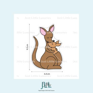 May include: A brown kangaroo with a joey in its pouch, a design for digital crafts. The kangaroo is 3.7 inches tall and 2.5 inches wide. The ears are pink. The text "Just Little Luxuries" is visible.