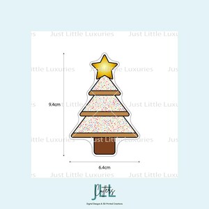 May include: A Christmas tree-shaped cookie cutter with a yellow star on top. The tree is 9.4cm tall and 6.4cm wide, with a brown outline and a white frosted area covered in colorful sprinkles. The base is brown.