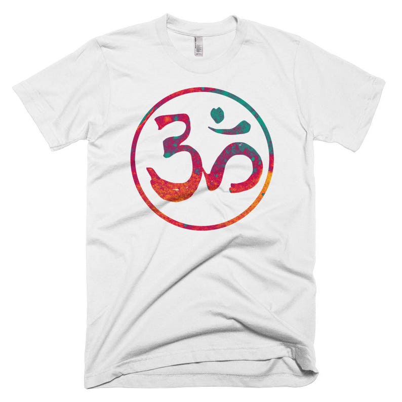 May include: White t-shirt with a colorful Om symbol in a circle. The symbol is a blend of red, orange, yellow, green, and blue.