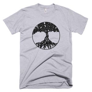 May include: A heather grey t-shirt with a black tree of life design in a circle.