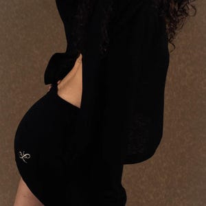 Luxury Black mini skirt with a drawstring waist, exquisitely designed with a refined silhouette for elevated everyday wear