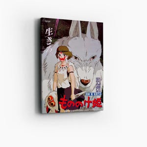 May include: A canvas print featuring a Japanese anime-style illustration. The artwork depicts a woman with red face paint and a white wolf. Japanese text is visible on the print, along with the title "Princess Mononoke."