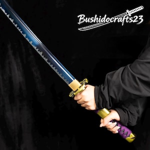 May include: A katana sword with a blue blade and gold accents. The handle is wrapped in purple fabric. The text "Bushidocrafts23" is in the upper right corner.