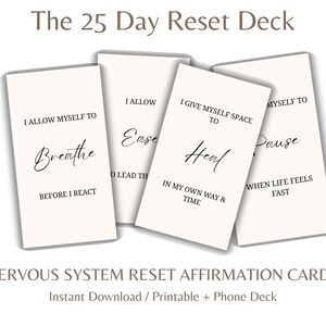 May include: Four affirmation cards from "The 25 Day Reset Deck" are displayed. Each card has a different affirmation in elegant script, including "Breathe" and "Heal". The cards are light beige with black text. The bottom text reads "Nervous System Reset Affirmation Cards".