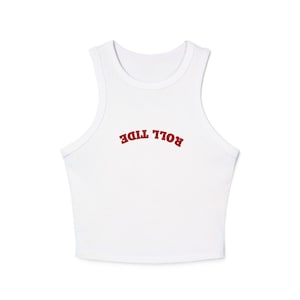 May include: White crop top with a scoop neck and the text "ROLL TIDE" in red, arched across the chest. The sleeveless top is made of a soft material, suitable for warmer weather.