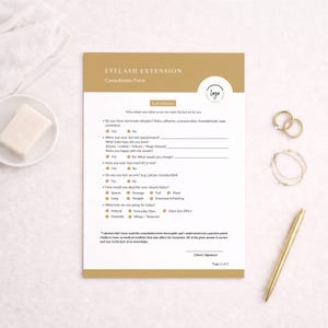 May include: A gold and white eyelash extension consultation form with a logo, and a gold pen, rings, and bracelet. The form includes questions about allergies, lash history, and desired style. The text on the form reads "Eyelash Extension Consultation Form".