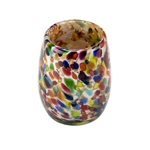 May include: A colorful glass tumbler with a speckled pattern in shades of red, orange, yellow, green, blue, and purple.