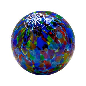 May include: A blue glass sphere with a multi-colored confetti pattern. The sphere has a small, clear glass knob on top.