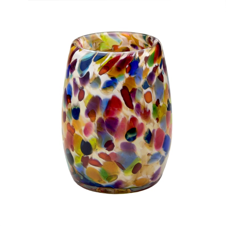 May include: A colorful glass vase with a speckled pattern in shades of red, blue, green, yellow, and white.
