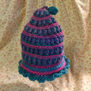 Baby crochet hat – One of a kind hat made of hot pink, purple and turquoise yarns accented with fun ruffle on the bottom!