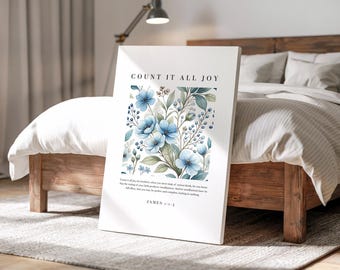 Könnte beinhalten: Ein weißer Leinwanddruck mit dem Text "COUNT IT ALL JOY" über einem Aquarell-Blumenmuster mit blauen Blumen und grünen Blättern. Der Druck enthält einen Bibelvers und wird auf einem Bett angezeigt.