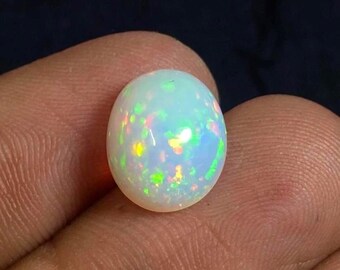 Naturlig etiopisk opal cabochon, prickig eldopal ädelsten.(12 x 10 MM)