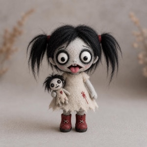 May include: A needle-felted doll with pale gray skin, large round eyes, and black hair in pigtails. The doll wears a cream-colored dress with red stitched details and red boots, while holding a smaller matching doll with button eyes.